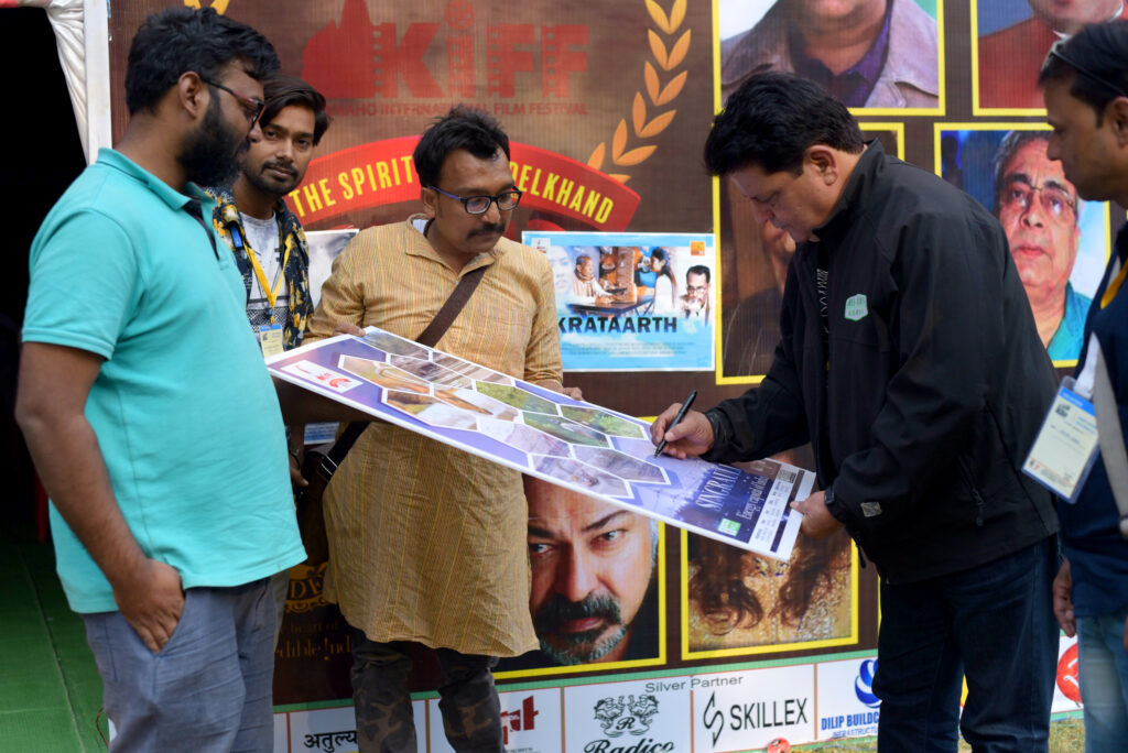 Director Ram Bundela Singing the Poster